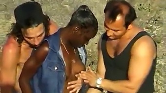 Two White Men Take Turns Fucking A Black Woman On A Beach